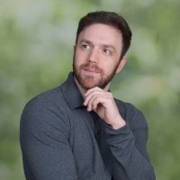 Warren Wynn, looking thoughtfully to the side with his hand at his chin
